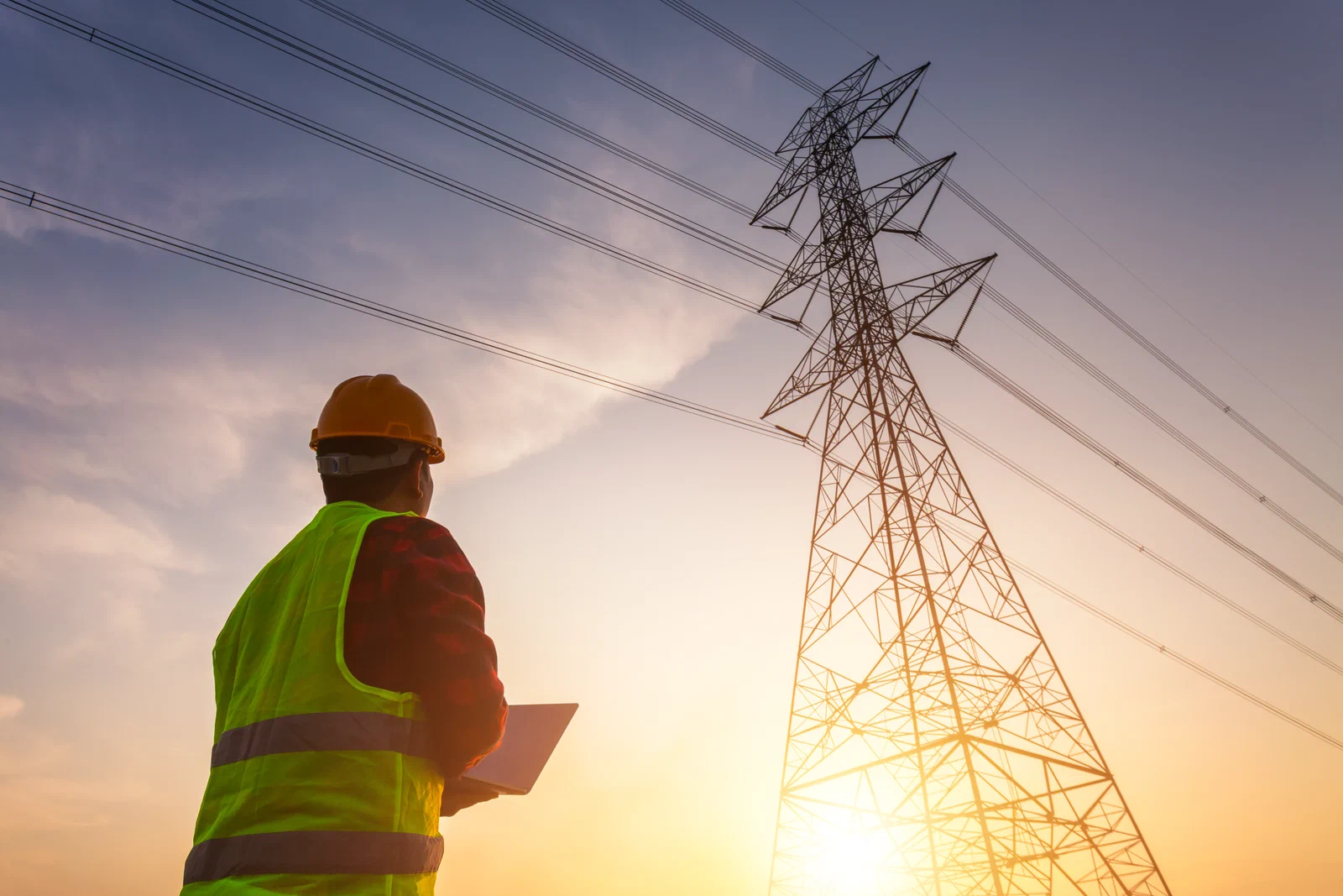 Electric utility communications tower installed adjacent to an energized substation