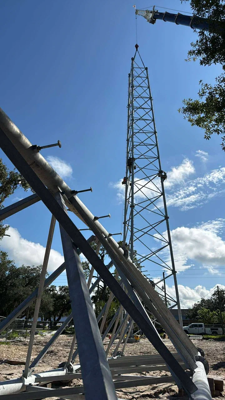 Decommissioned tower section staged on the ground during a controlled teardown