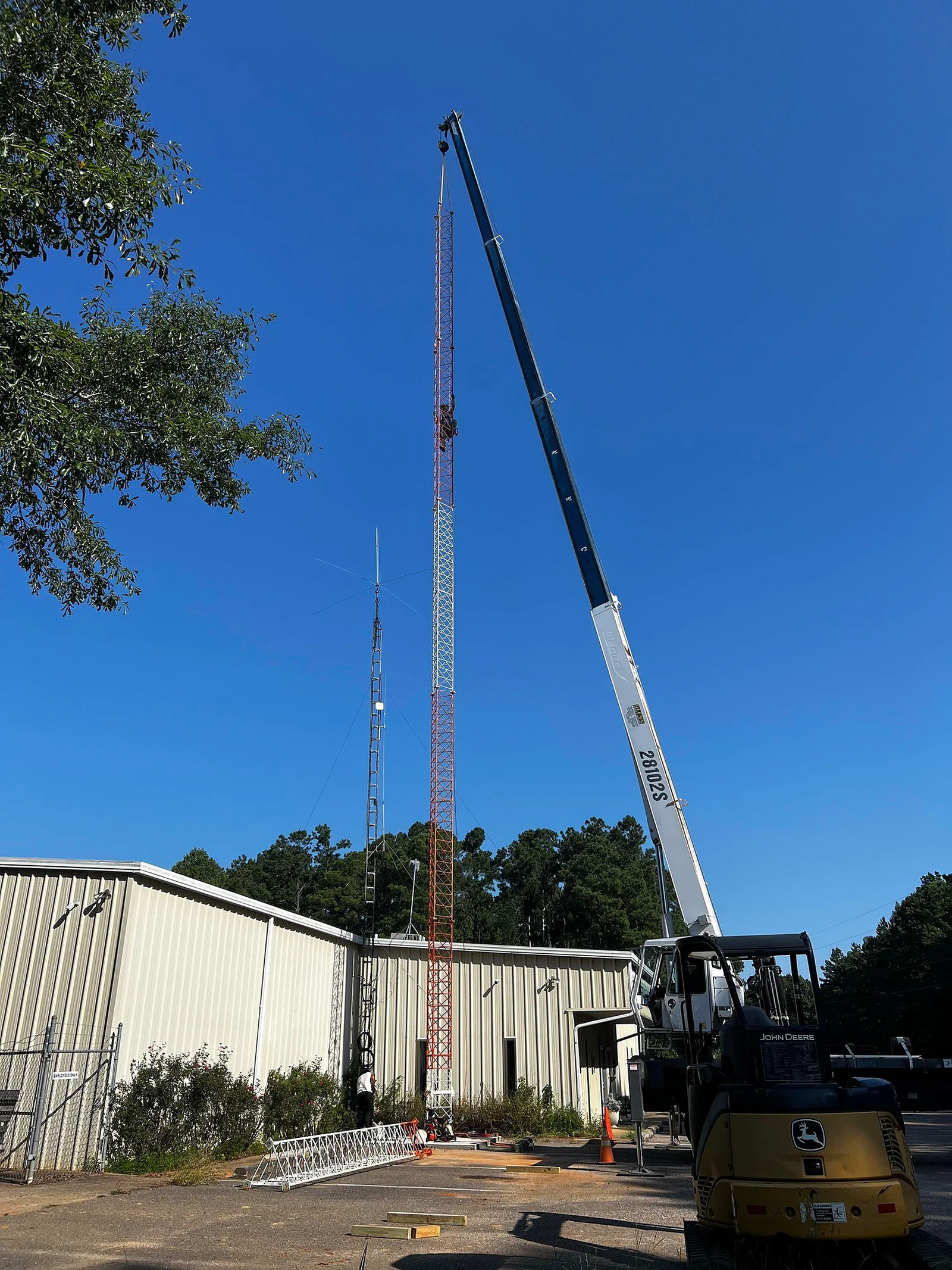 Climber decommissioning legacy antennas on a modification scope
