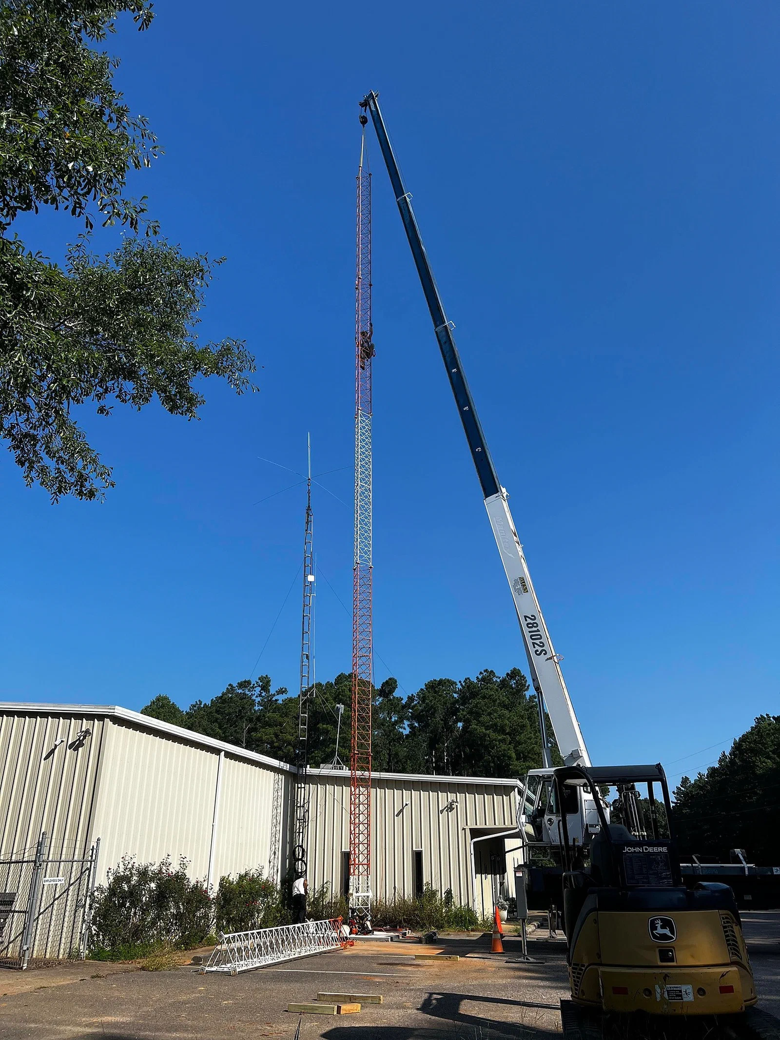 Climber decommissioning legacy antennas on a modification scope